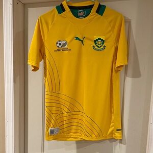 Puma Yellow short sleeve shirt with green & black strip on the collar size small
